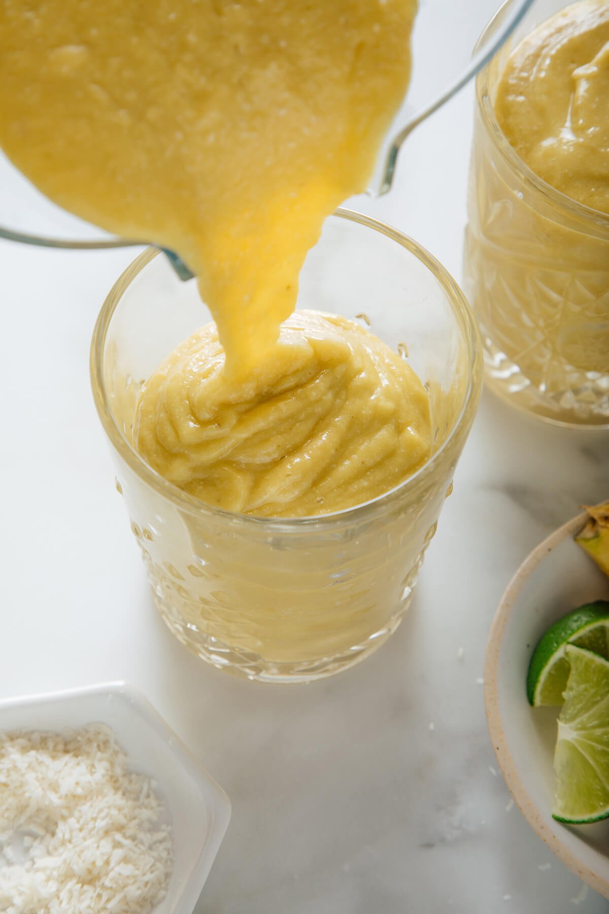 pouring pineapple avocado smoothie