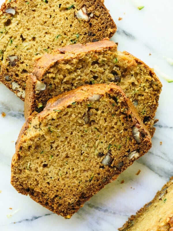 Fluffy and moist zucchini bread, made healthier with whole grains, natural sweetener (honey or maple syrup), and coconut oil instead of butter. cookieandkate.com