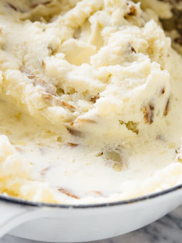 My family's favorite mashed potatoes—they're ultra creamy, a little tangy, and you can make them ahead! #Thanksgiving