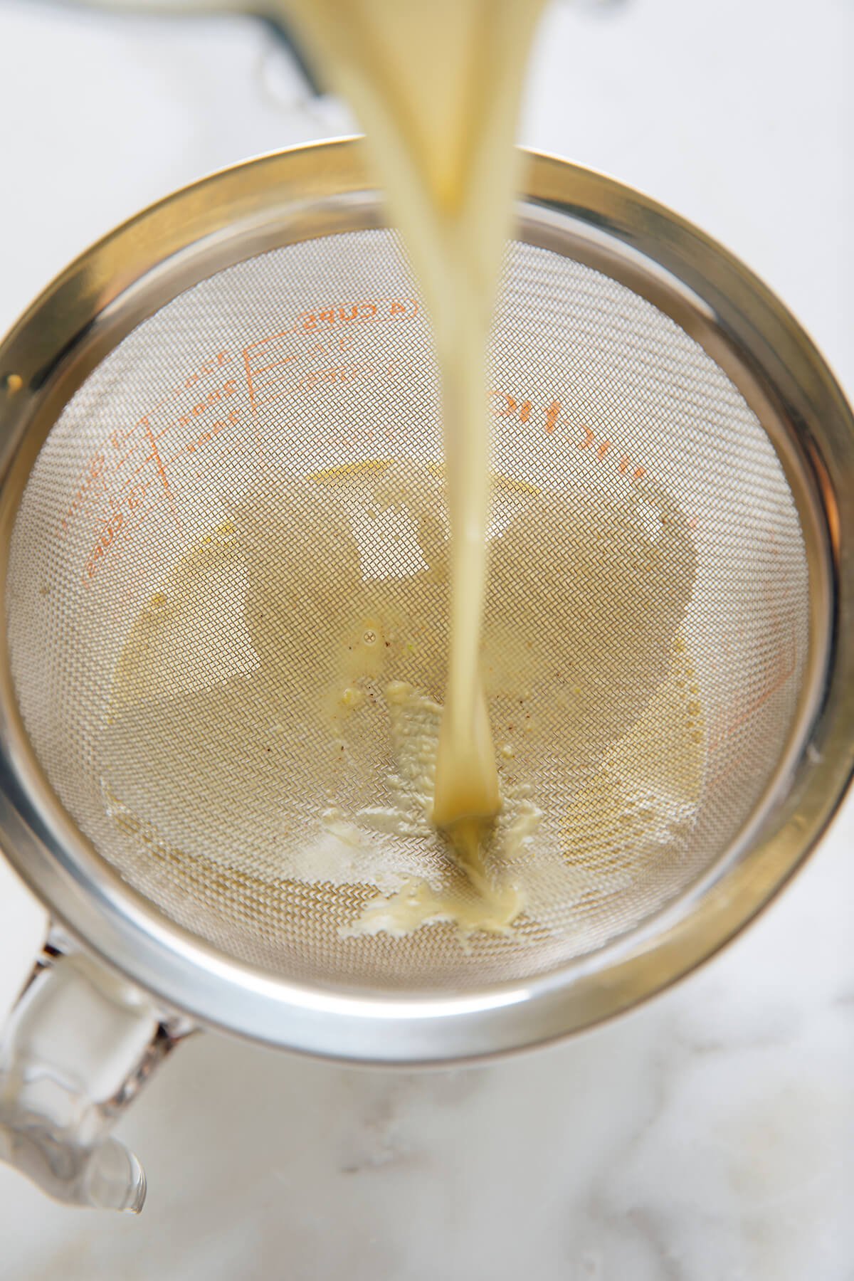 straining pistachio milk