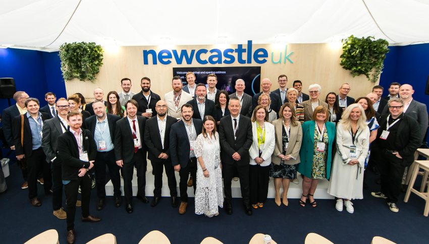 Group shot of Newcastle delegates on the Newcastle stand at UKREiIF