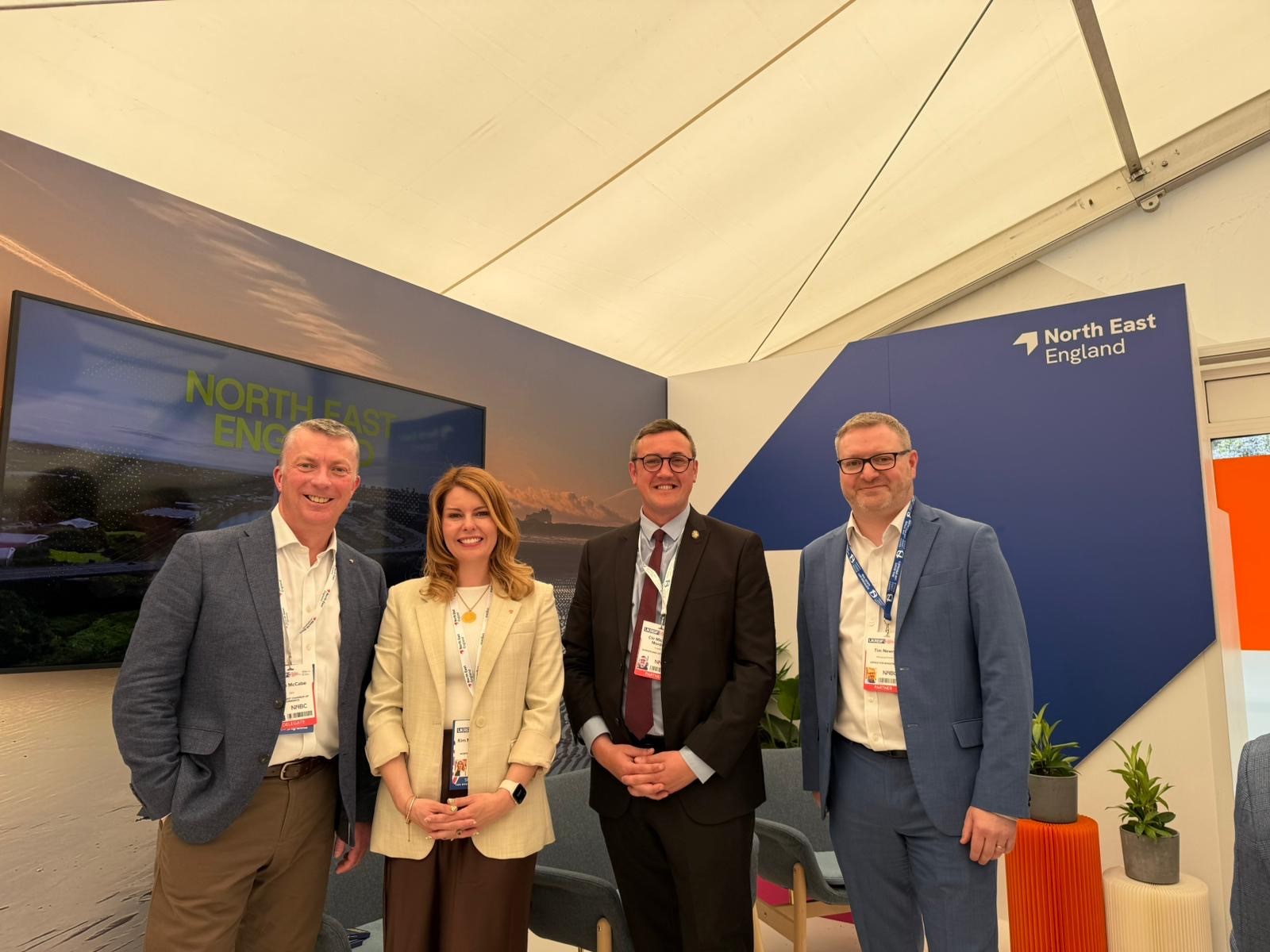 A photograph of North East Mayor Kim McGuinness with Cllr Micheal Mordey, Portfolio holder for Finance and Investment, North East Combined Authority, Tim Newns, Managing Director Office for Investment, John McCabe, Chief Executive, North East Chamber of Commerce and Chair of the Business & Economy Board at North East Combined Authority and Sanda Manson, Vice-Chair of the Business & Economy Board and chair of the business organisation Developing Consensus.