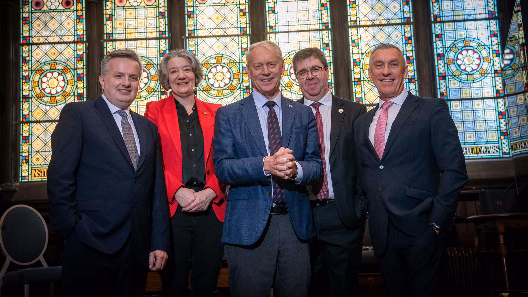 The five Vice Chancellors of the North East universities together in front of grand stained glass windows.