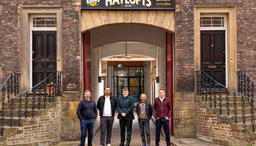 Team from AMA and Newcastle Council Deputy Leader stood outside of the Haylofts office building.