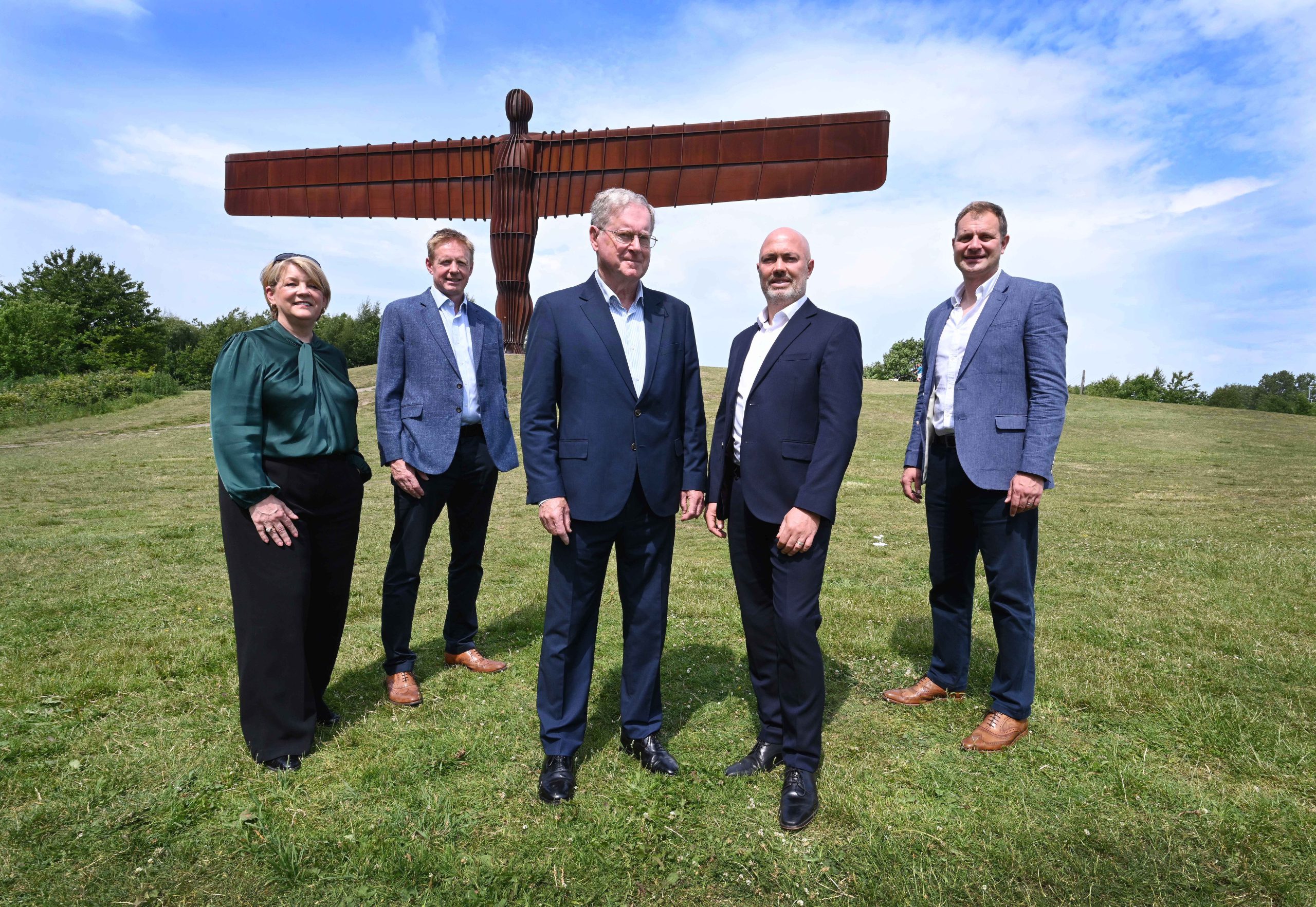 Group from Develop North posing in front of Angel of the North