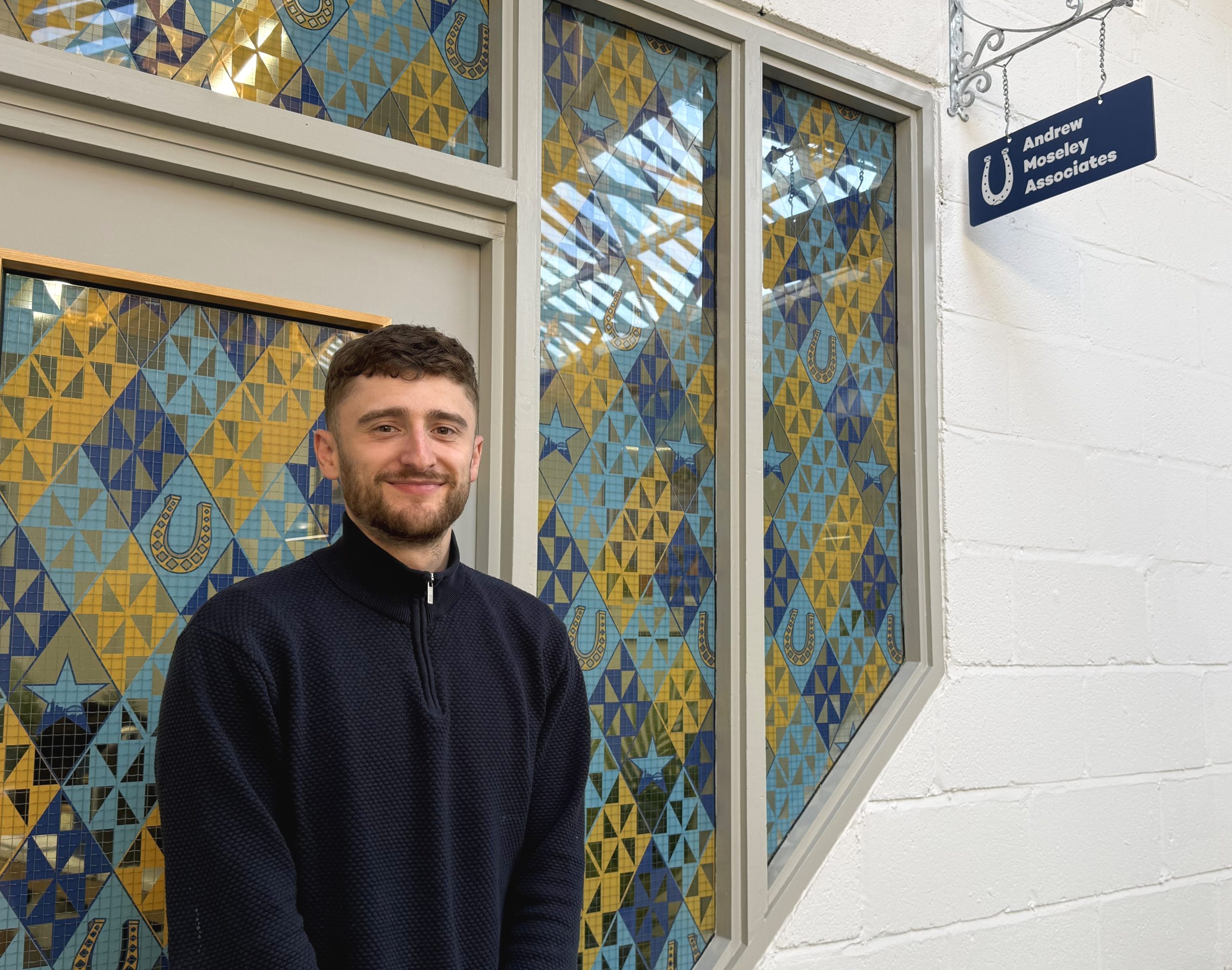 Jonny Hocke smiling outside of AMA office.