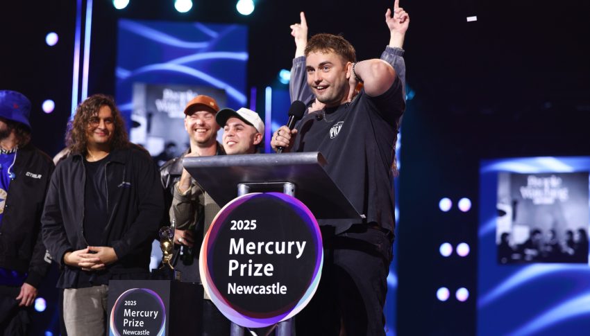 Sam Fender and his band on stage accepting the Mercury Prize